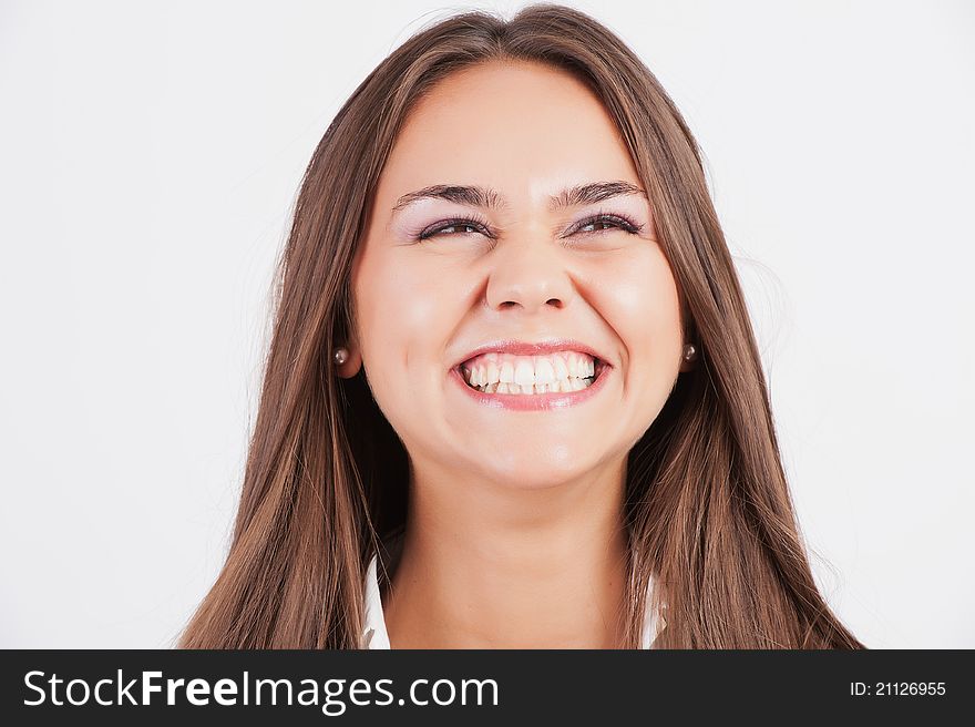 Closeup of beautiful young woman screaming in excitemant over white background