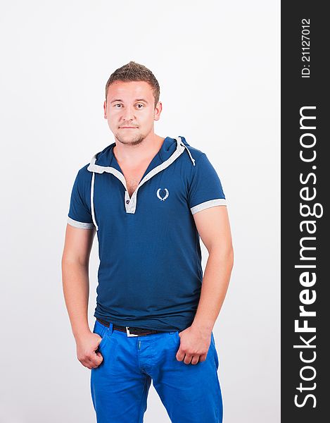 Portrait of happy good looking man smiling over white background