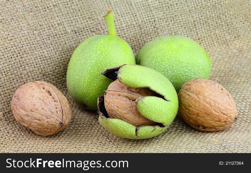 Young walnuts on the linen texture