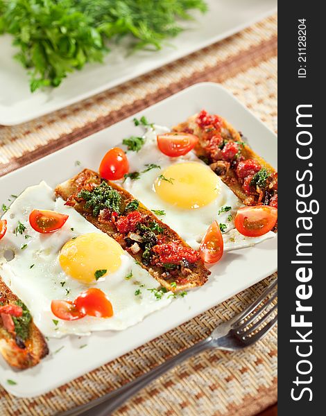 Fried Eggs with Cherry Tomato, Toast with Pesto Sauce and Bacon