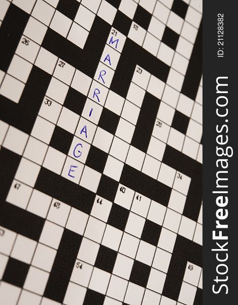 The word marriage on a crossword puzzle. The word marriage on a crossword puzzle