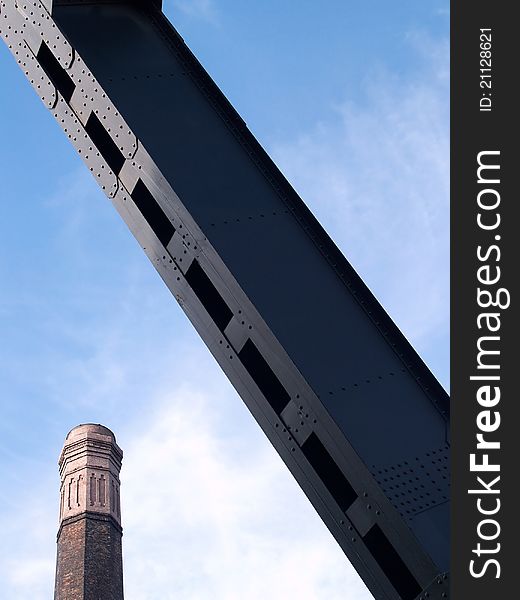 Brick chimney and metal ribband in komplex of and old mine called Alexander, Ostrava city, Czech republic