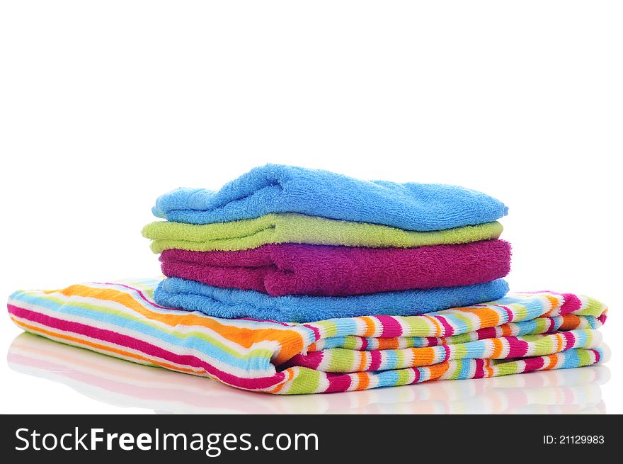 Colorful towels made in a studio with a white background. Colorful towels made in a studio with a white background