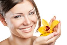 Young Beautiful Woman With Orchid Royalty Free Stock Photography