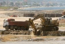 Bulldozer Loading A Truck Stock Images