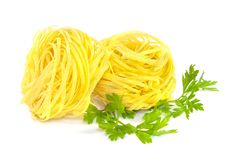 Raw Pasta Nests And Green Parsley On White Royalty Free Stock Image Raw Pasta Nests And Green Parsley On White Royalty Free Stock Image