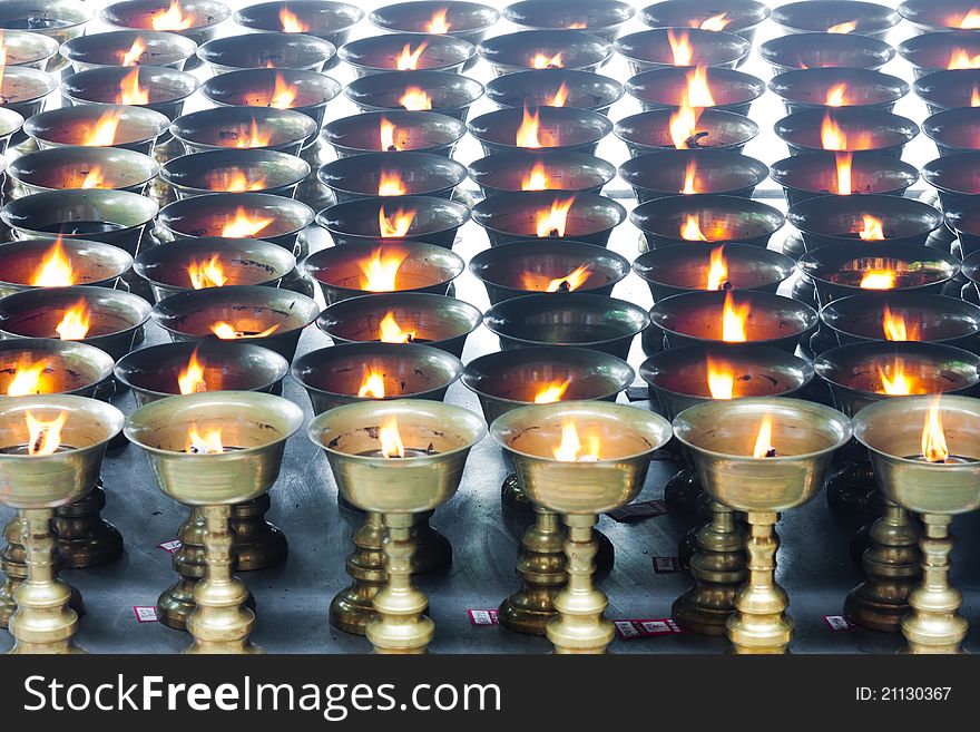 Buddhist butter lamps in temple