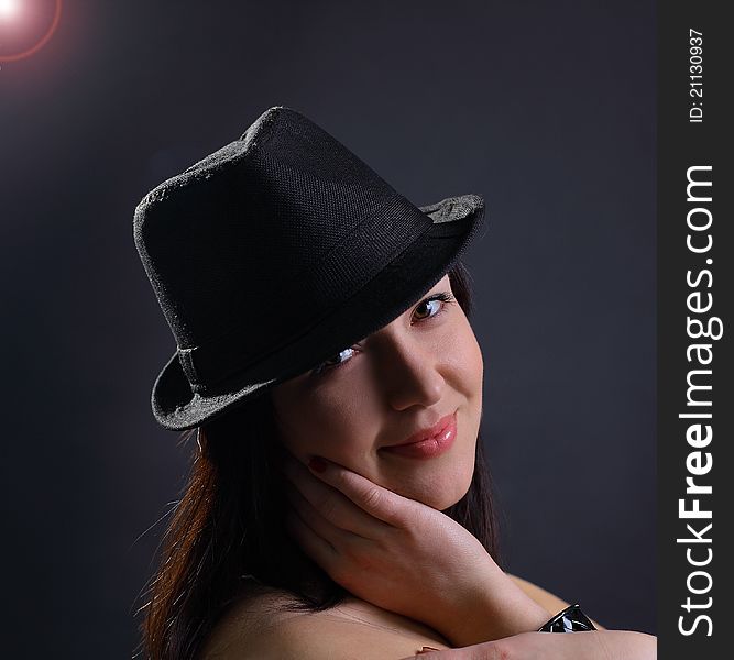 Portrait of a beautiful young woman in hat. Portrait of a beautiful young woman in hat