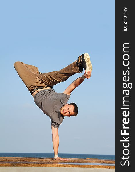 Male breakdancer on natural background