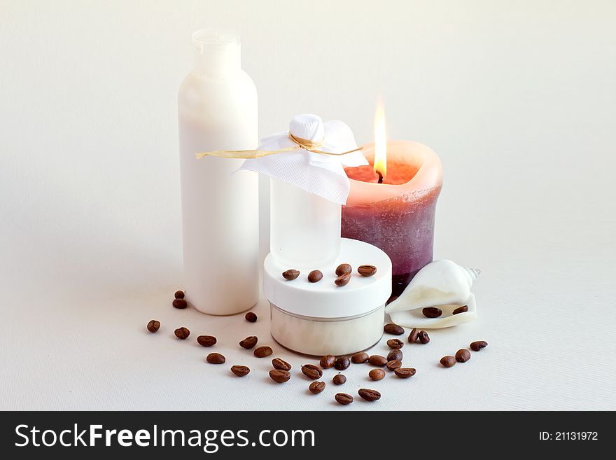 Cream, shell, coffee beans and candles. Cream, shell, coffee beans and candles