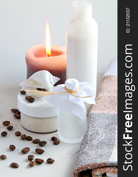 Cream, shell, coffee beans and candles. Cream, shell, coffee beans and candles