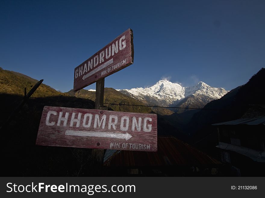 A signpost to ghorepani or chhomrong nepal