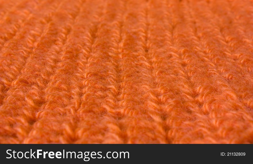 Orange knit macro, focus on the central part of it. Orange knit macro, focus on the central part of it.