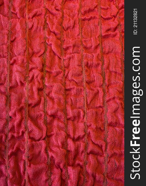 Red background with wavy fabric texture. Red background with wavy fabric texture.