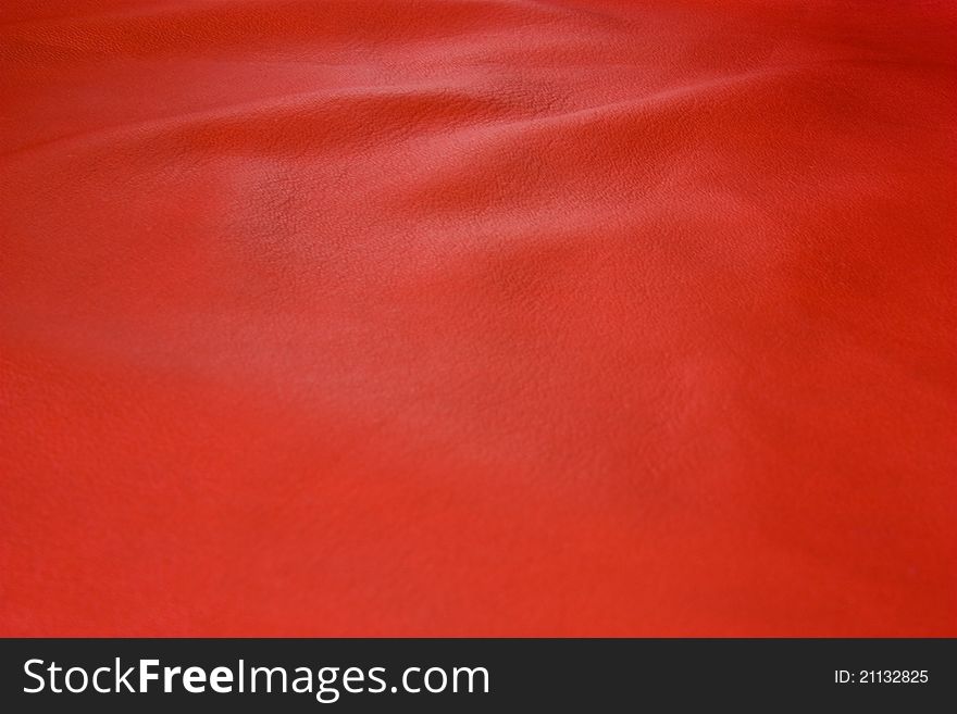Abstract burgundy background with leather texture and waves. Abstract burgundy background with leather texture and waves