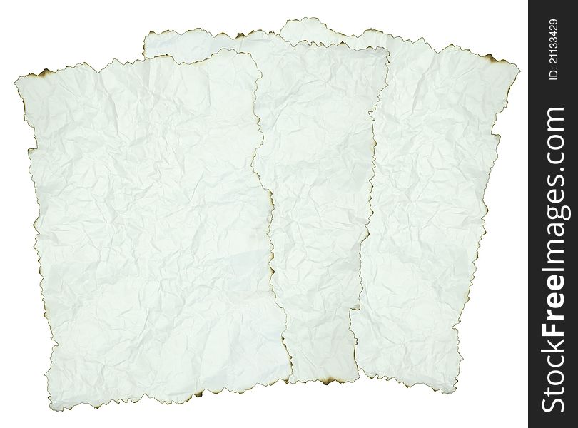 Crumpled paper with burnt edges over white