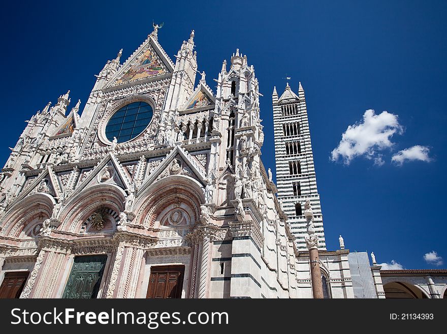 The ancient cathedral of Siena with its bell tower. The ancient cathedral of Siena with its bell tower