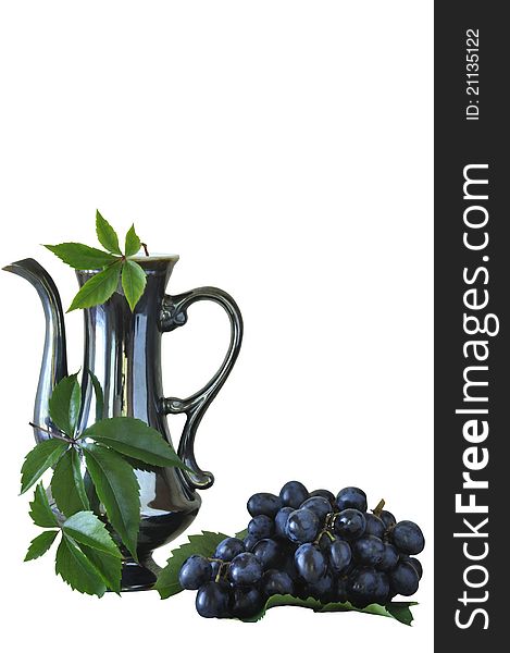 Grapes and old jug on the white isolated background