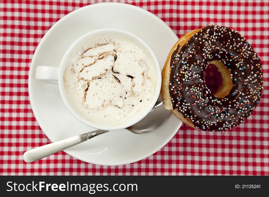 Donuts with coffee on table.
