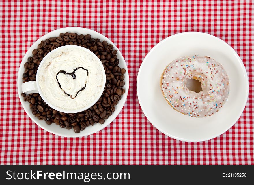 Donuts With Coffee On Table.