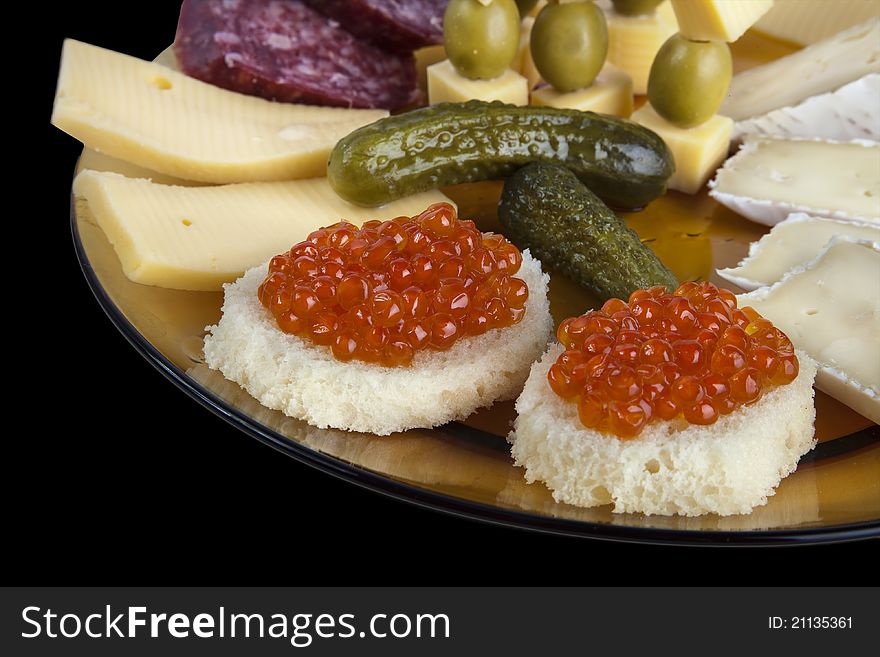 Plate with Caviar Canapes, Cheese and Grapes