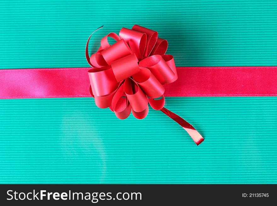 Color photo of a bow on red ribbon. Color photo of a bow on red ribbon