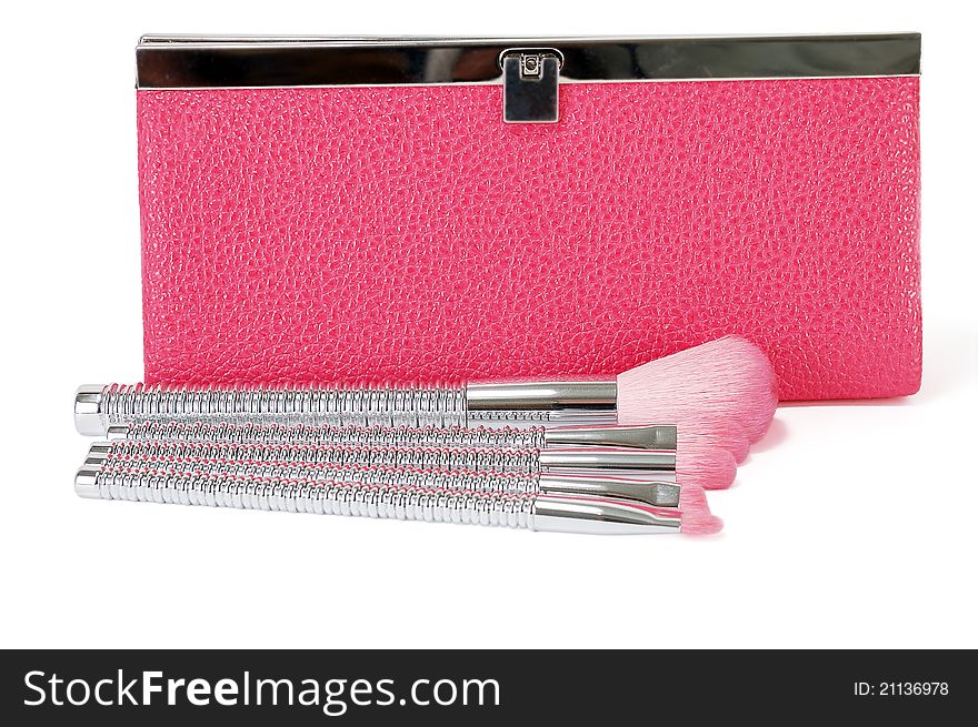 Pink cosmetic bag with cosmetic brushes