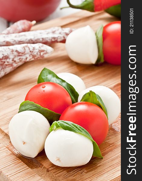 Mozzarella skewers with tomato and basil