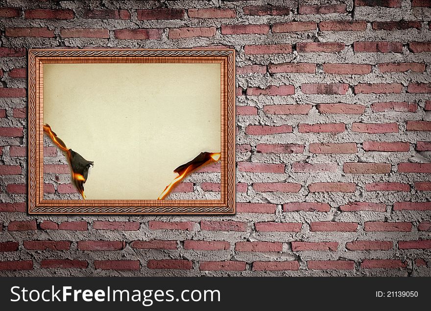Vintage gold frame with burned on wall background