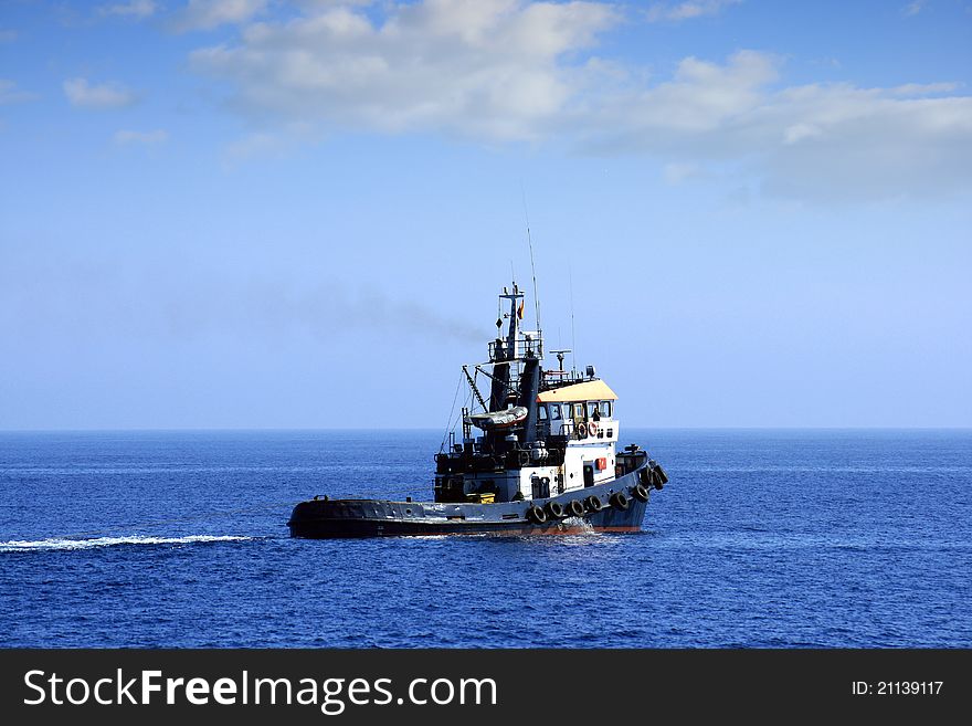 Old tug in open waters