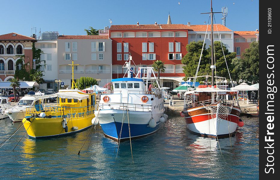 Three colorful ship moored in a small european town. Three colorful ship moored in a small european town
