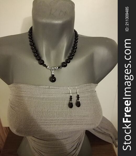 The whole Black Pearl necklace collar with earrings, surprised in a photo on our mannequin. Beautiful handmade jewelry we mostly my mom produce and sell. The whole Black Pearl necklace collar with earrings, surprised in a photo on our mannequin. Beautiful handmade jewelry we mostly my mom produce and sell