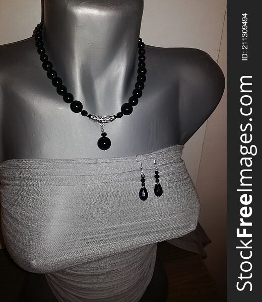 The whole Black Pearl necklace collar with earrings, surprised in a photo on our mannequin. Beautiful handmade jewelry we mostly my mom produce and sell. The whole Black Pearl necklace collar with earrings, surprised in a photo on our mannequin. Beautiful handmade jewelry we mostly my mom produce and sell