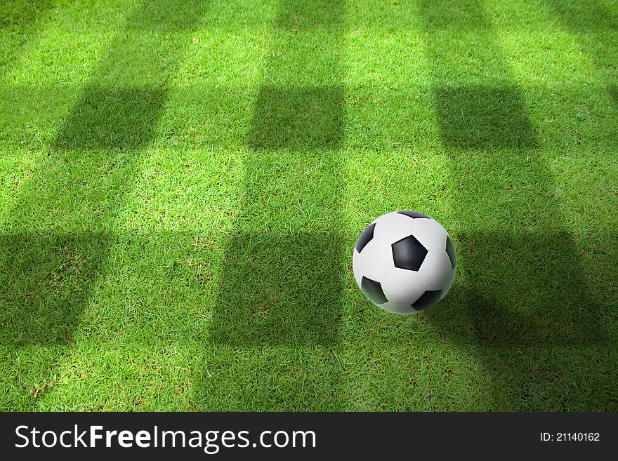 A ball on the green grass of football field. A ball on the green grass of football field