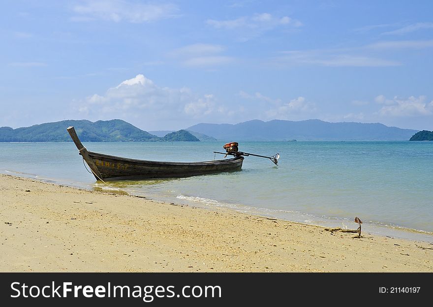 Thai boat in a turquoise sea near the beach