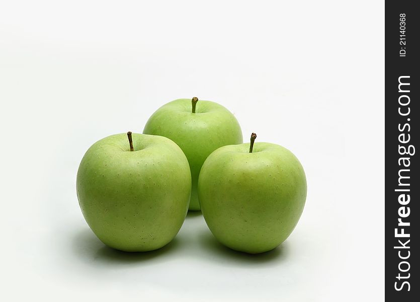 Placed on a white background of the three apples