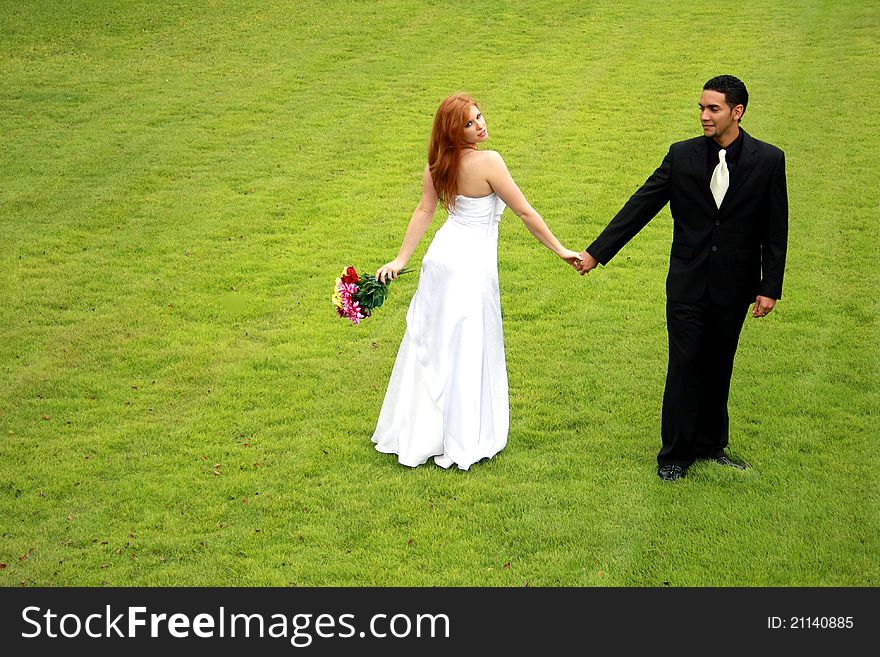 Bride and Groom on Green Lawn