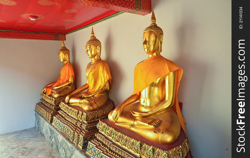 Golden sitting Buddha statues in Wat Pho,Bangkok, Thailand
