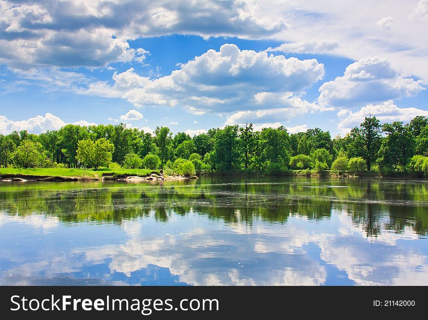 Clouds Reflection On Lake.