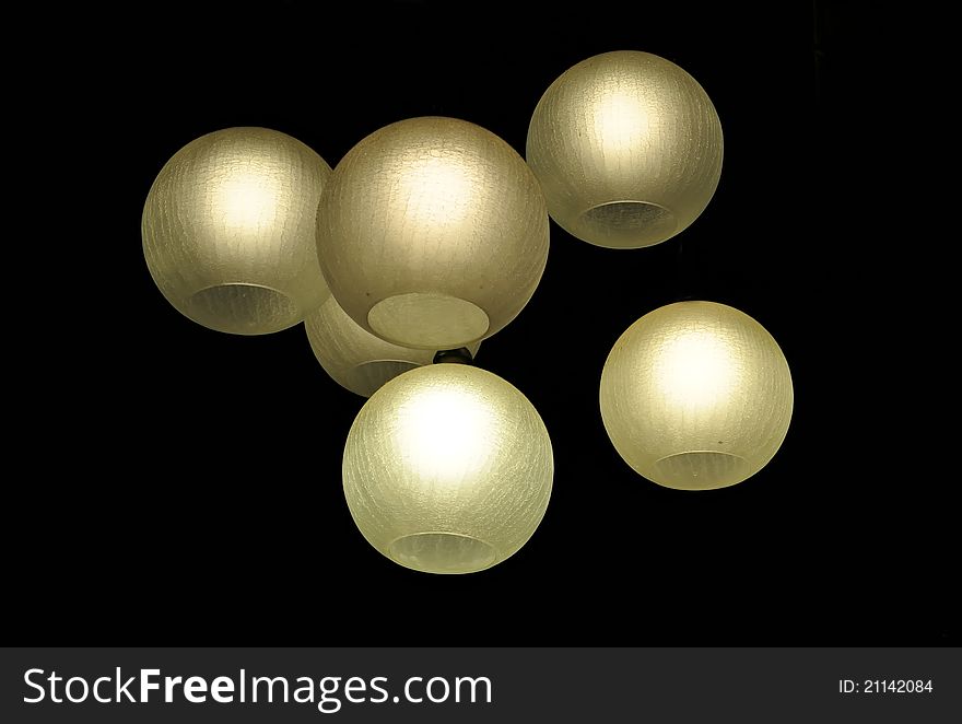 Six glowing ball lights on black isolated background. Six glowing ball lights on black isolated background