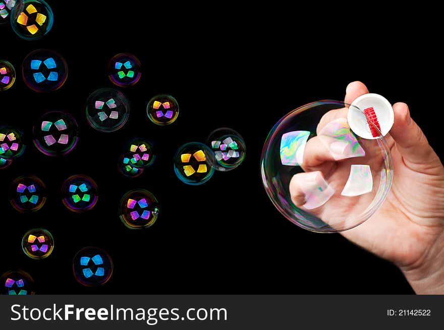 Many colored bubbles isolated on a black background