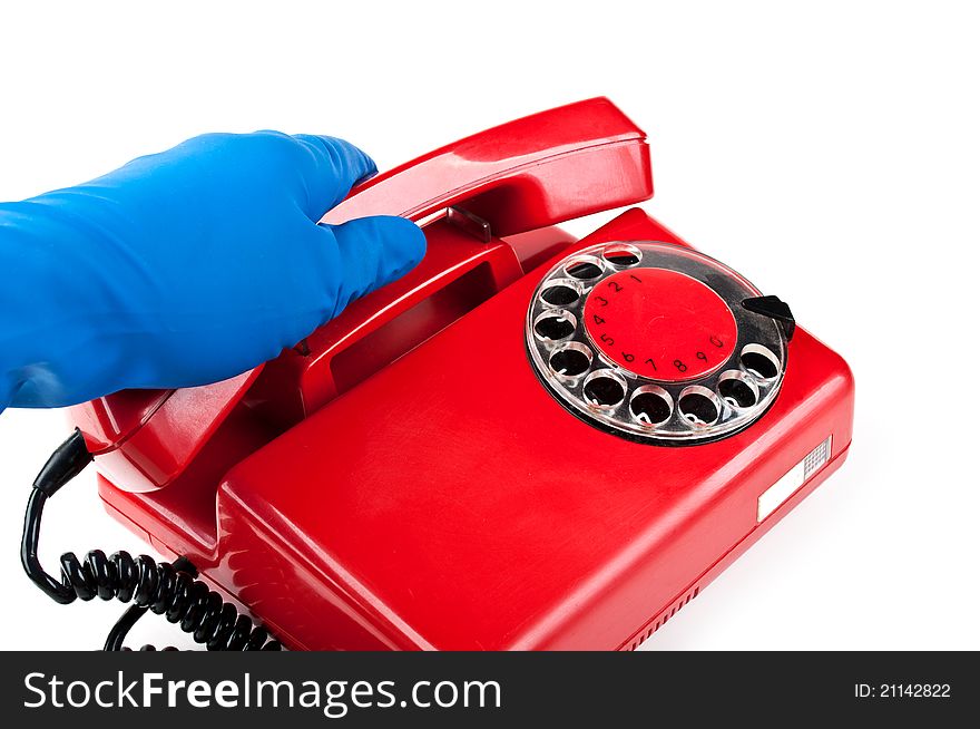 Man in blue gloves picked it up the red phone isolated on a white background. Man in blue gloves picked it up the red phone isolated on a white background