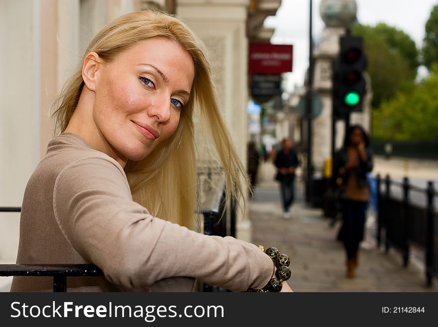 A young beautiful woman posing outdoors.