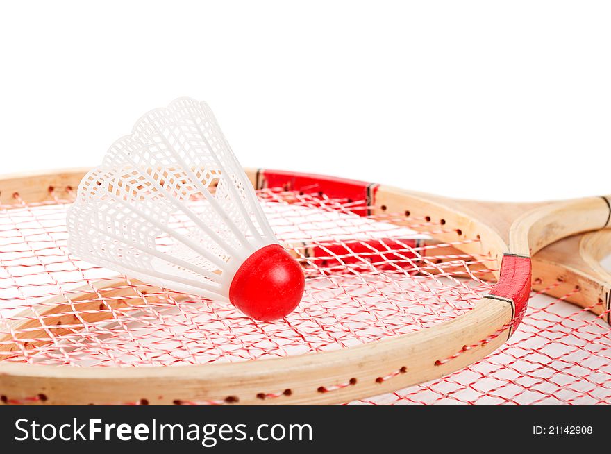 Old badminton and red shuttlecock isolated on a white background