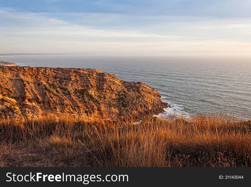 Beautiful cliff over the Atlantic Ocean in region of Sesimbra. Beautiful cliff over the Atlantic Ocean in region of Sesimbra.