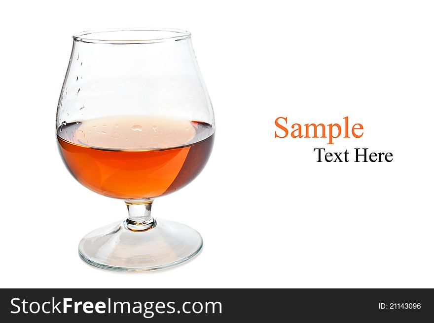 Cognac in a classic glass isolated on a white background