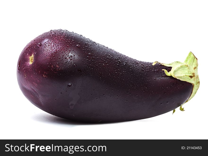 Fresh single eggplant with water drops isolated on white background with shadow. Fresh single eggplant with water drops isolated on white background with shadow