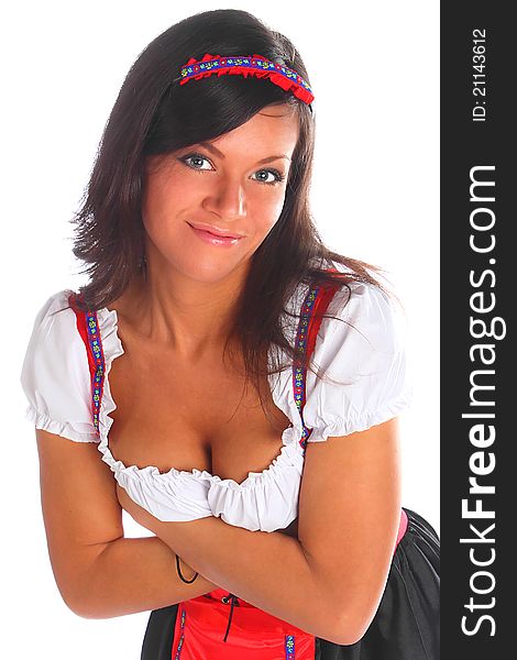 The girl in a traditional Bavarian dress with full glasses of beer in hands