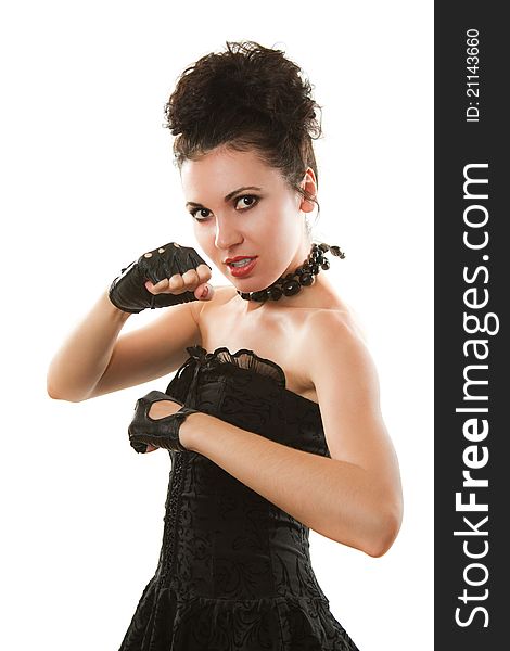 Russian woman in a black dress and gloves in a pose of a boxer on a white background. Russian woman in a black dress and gloves in a pose of a boxer on a white background