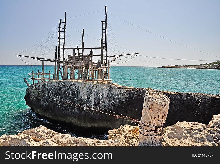 Trabucco is an old fishing machine typical of the coast of Gargano in the Apulia region of southeast Italy. It is protected as historical monument. Trabucco is an old fishing machine typical of the coast of Gargano in the Apulia region of southeast Italy. It is protected as historical monument.